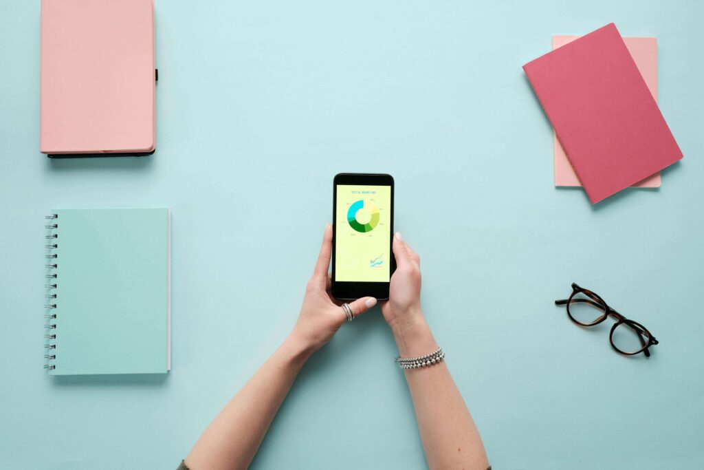 A person checking their credit score on a smartphone before applying for a credit card
